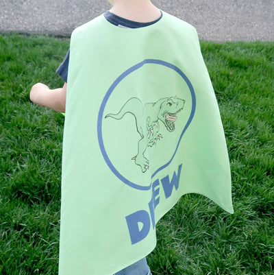 Dinosaur in Blue Circle on Green